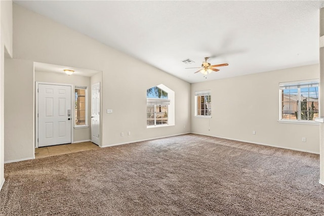 1951 E Oatman Pl, Mohave Valley, AZ 86440 - empty room with carpet, a ceiling fan, and tile patterned flooring