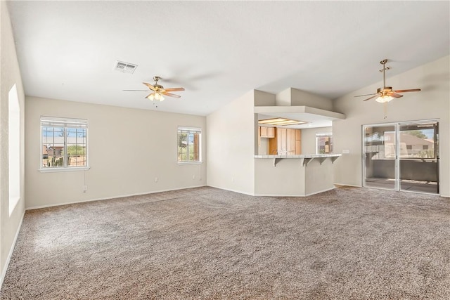 1951 E Oatman Pl, Mohave Valley, AZ 86440 - unfurnished living room featuring ceiling fan, carpet flooring, and vaulted ceiling