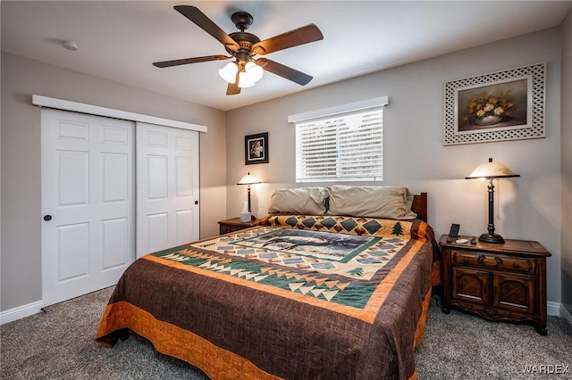 bedroom with a closet, baseboards, a ceiling fan, and carpet
