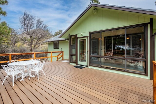 wooden deck with outdoor dining area