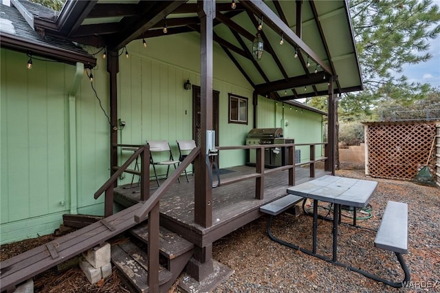 wooden deck featuring area for grilling