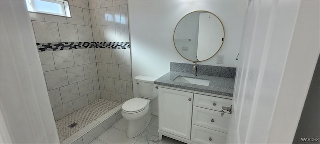 full bath with toilet, a stall shower, and vanity