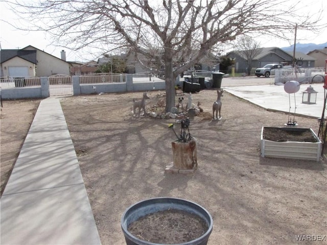 exterior details featuring a fenced front yard and a gate