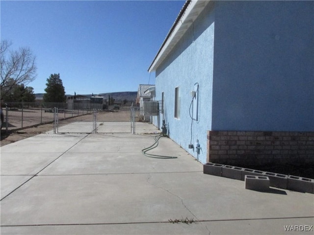 view of patio / terrace featuring a gate and fence