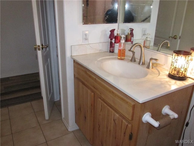 bathroom with tile patterned flooring and vanity