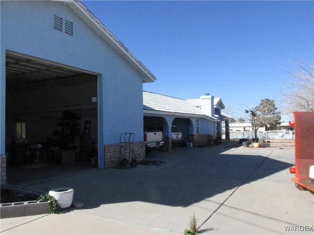 view of side of property with stucco siding