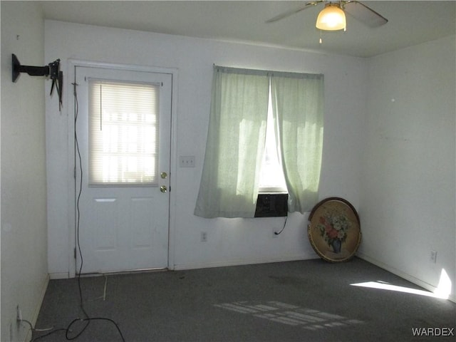 interior space featuring carpet and ceiling fan