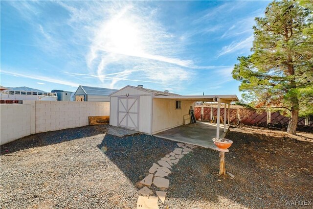 view of shed featuring a fenced backyard