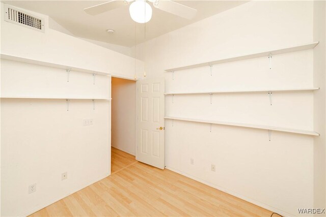 interior space featuring visible vents and a ceiling fan