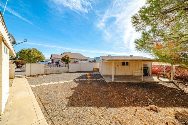 exterior space with a patio and a fenced backyard