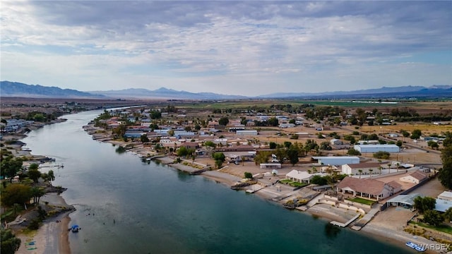 drone / aerial view featuring a residential view and a water and mountain view