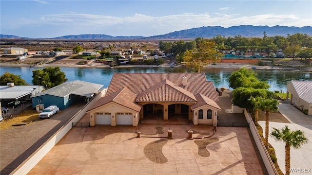 bird's eye view with a water and mountain view