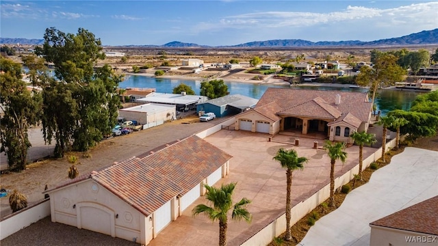 bird's eye view featuring a residential view and a water and mountain view