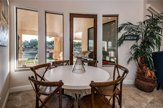 dining area featuring baseboards