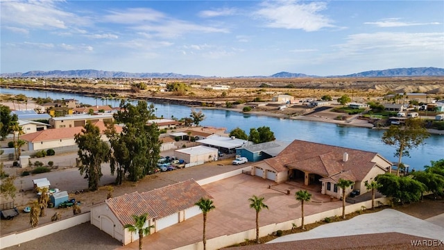 birds eye view of property with a residential view and a water and mountain view