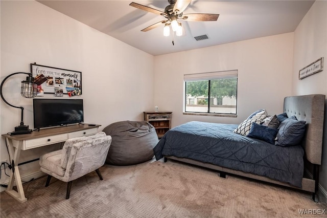 bedroom with a ceiling fan, visible vents, carpet floors, and baseboards