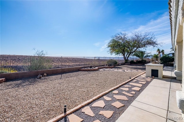 view of yard with a patio area and a fenced backyard