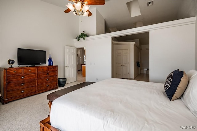 bedroom with high vaulted ceiling, visible vents, and a ceiling fan