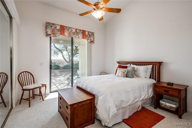 bedroom with access to exterior, light colored carpet, vaulted ceiling, and ceiling fan