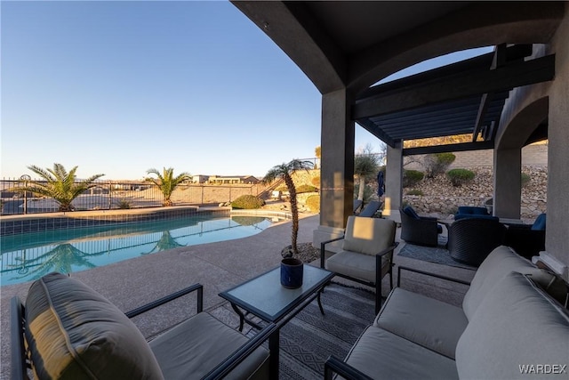 view of patio / terrace featuring a fenced in pool, a fenced backyard, and an outdoor hangout area