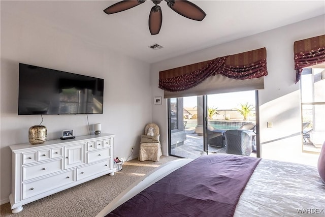 bedroom featuring a ceiling fan, access to outside, visible vents, and carpet