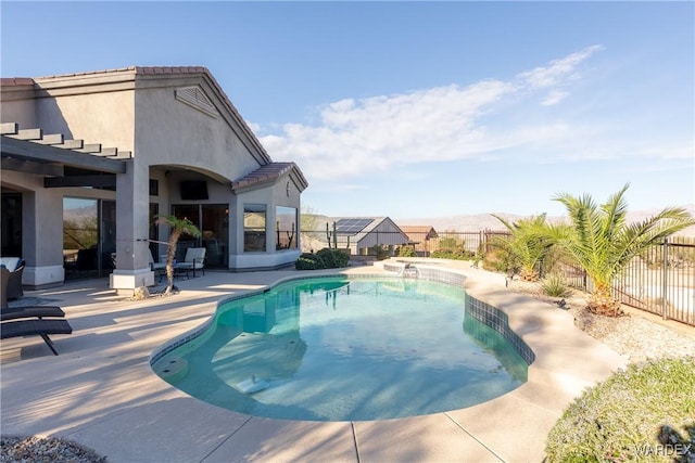 view of swimming pool with a fenced in pool, a fenced backyard, and a patio