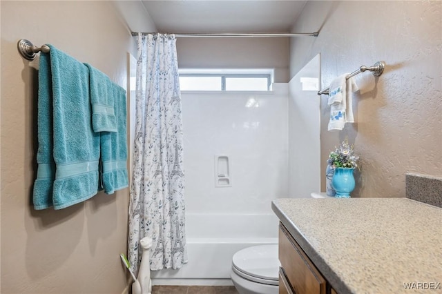 bathroom featuring shower / bath combination with curtain, toilet, and vanity