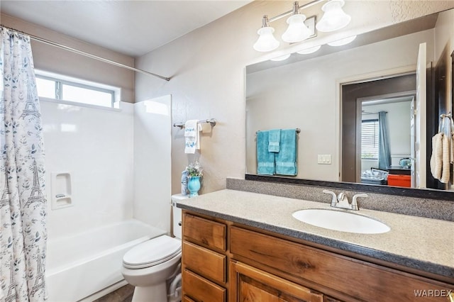 full bath with shower / bath combination with curtain, toilet, and vanity