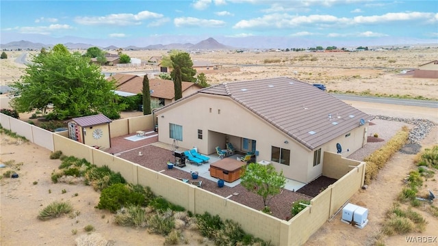 bird's eye view featuring a mountain view and view of desert