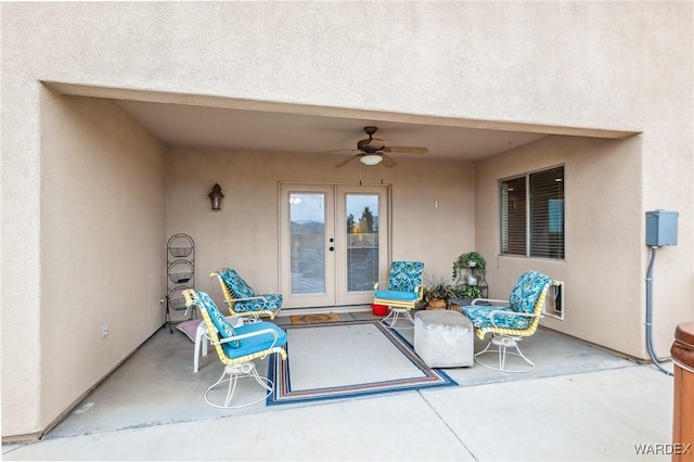 view of patio / terrace featuring ceiling fan and french doors