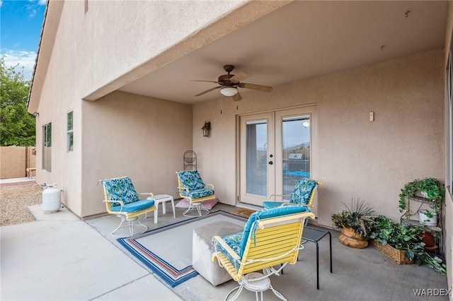 view of patio with fence, ceiling fan, and french doors