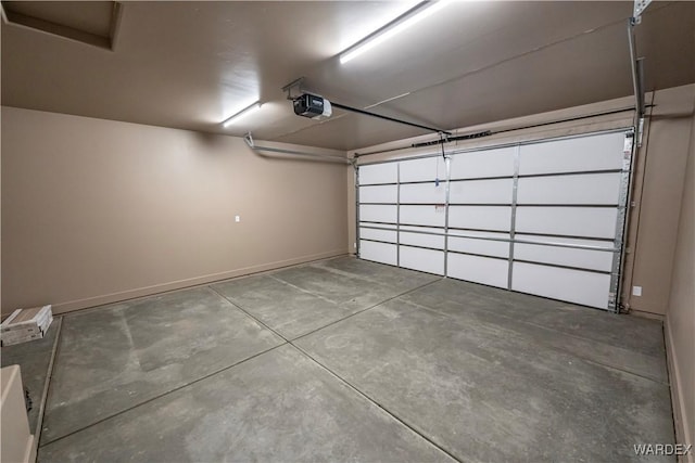 garage featuring baseboards and a garage door opener