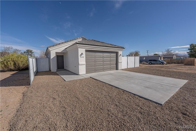 exterior space featuring fence and driveway