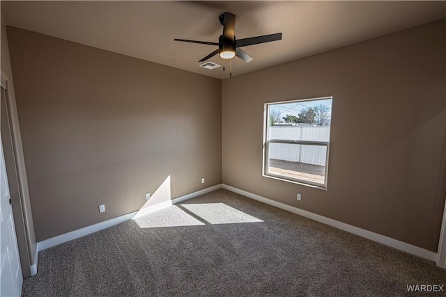 empty room with a ceiling fan, baseboards, visible vents, and carpet flooring