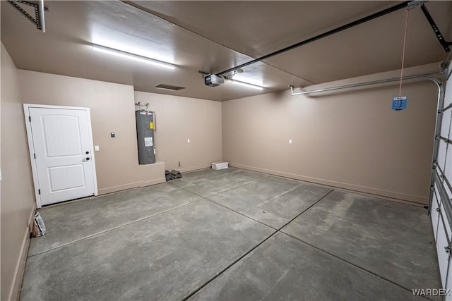 garage with water heater, a garage door opener, and baseboards