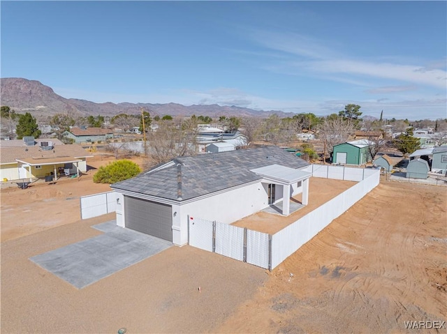 birds eye view of property featuring a mountain view