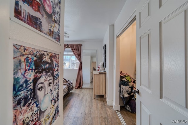 hallway with wood finished floors