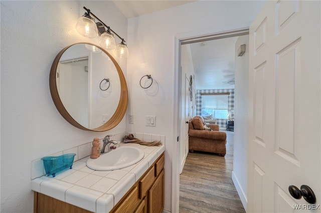 bathroom with vanity and wood finished floors