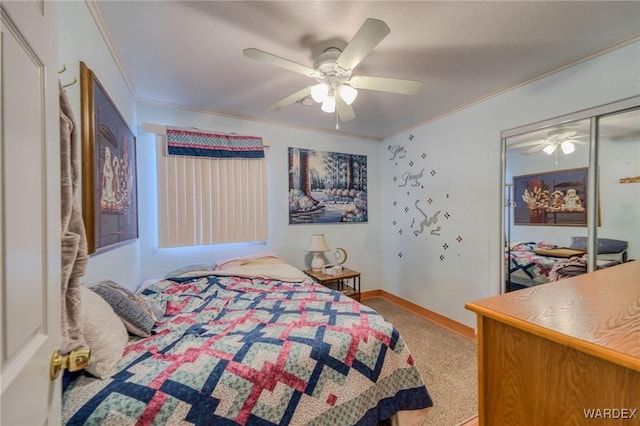 bedroom featuring carpet, crown molding, a closet, a ceiling fan, and baseboards