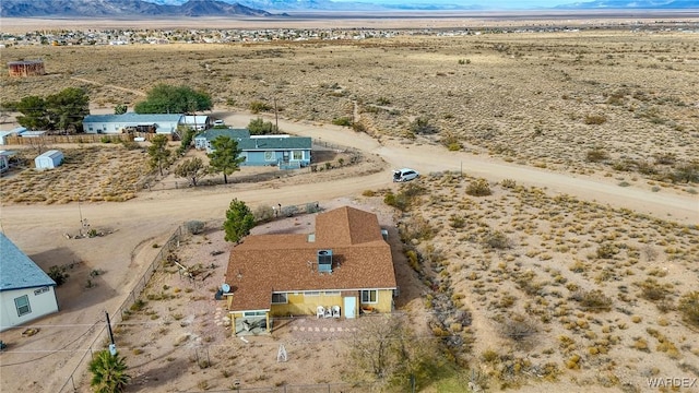 drone / aerial view with a mountain view and a desert view