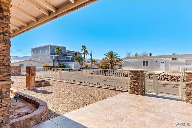 view of yard featuring a patio and fence