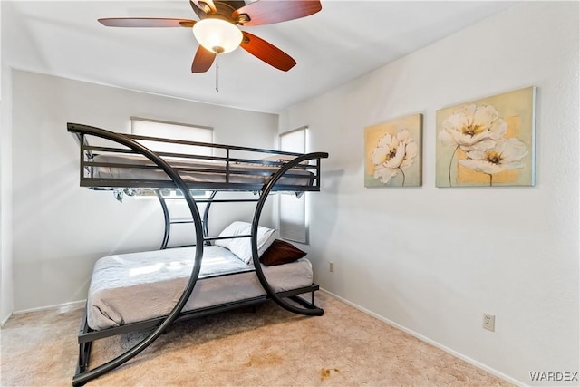 carpeted bedroom with baseboards