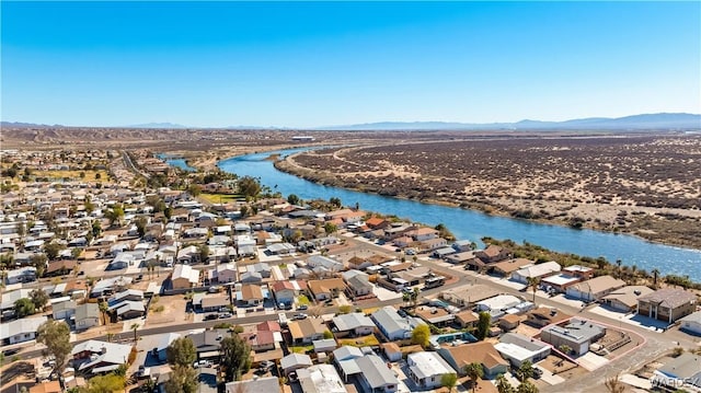 birds eye view of property with a residential view and a water and mountain view