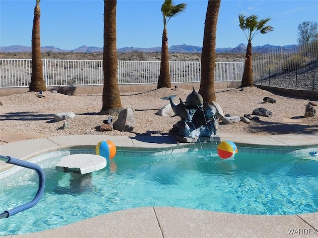 view of pool with fence private yard, a mountain view, and a fenced in pool