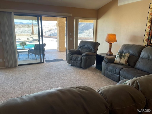 living room with light colored carpet