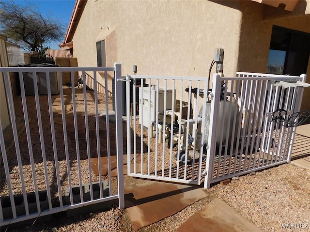 view of gate with fence