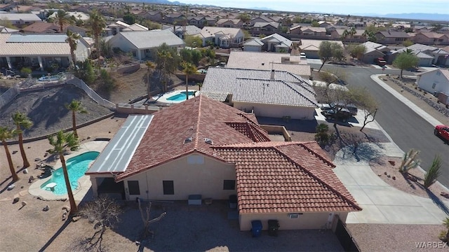 birds eye view of property with a residential view