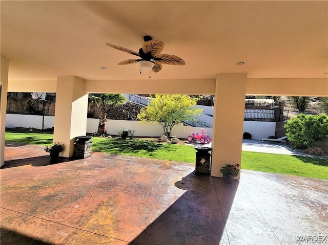 view of patio / terrace featuring ceiling fan and fence