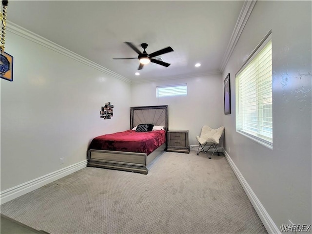 carpeted bedroom with ornamental molding and baseboards