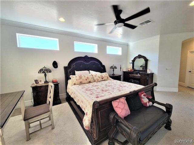 bedroom with arched walkways, light carpet, visible vents, ornamental molding, and multiple windows